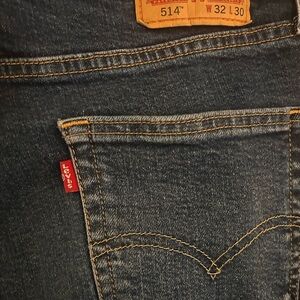 Levi's dark blue denim jeans with orange stitching